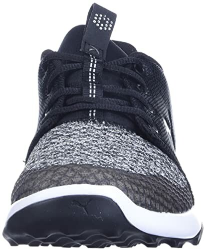 Front view of a black and white sneaker with textured details.